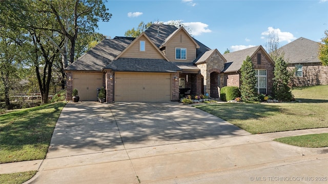 craftsman inspired home with a front lawn, concrete driveway, a shingled roof, a garage, and brick siding