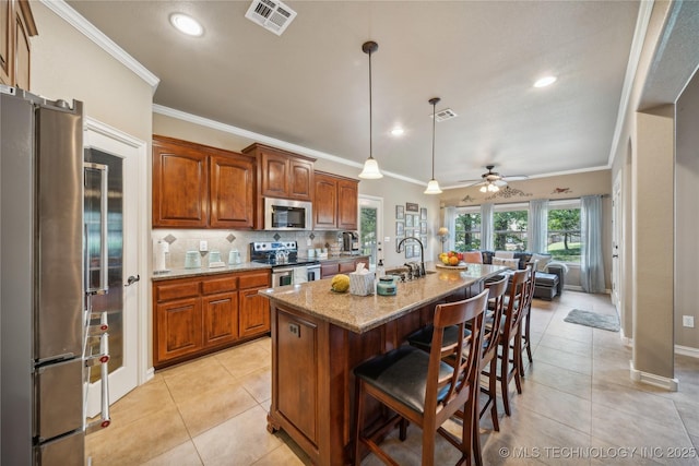 kitchen with visible vents, tasteful backsplash, appliances with stainless steel finishes, and light tile patterned flooring