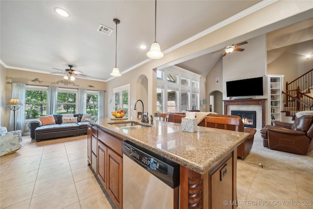 kitchen featuring open floor plan, dishwasher, visible vents, and a sink