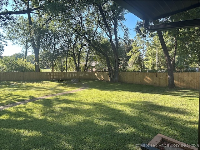 view of yard with a fenced backyard