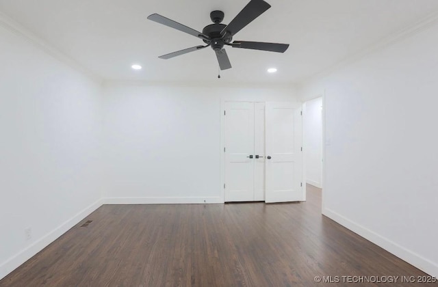 spare room with recessed lighting, baseboards, and dark wood-style flooring