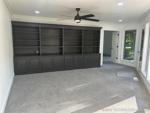 interior space featuring recessed lighting, visible vents, a healthy amount of sunlight, and ornamental molding