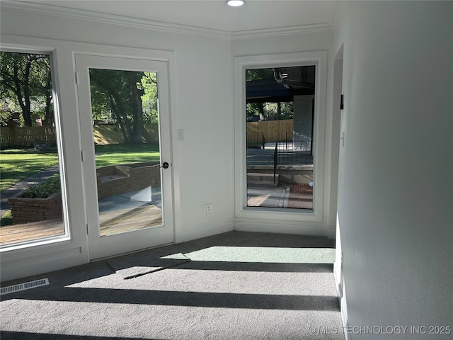 entryway with recessed lighting, carpet, visible vents, and ornamental molding