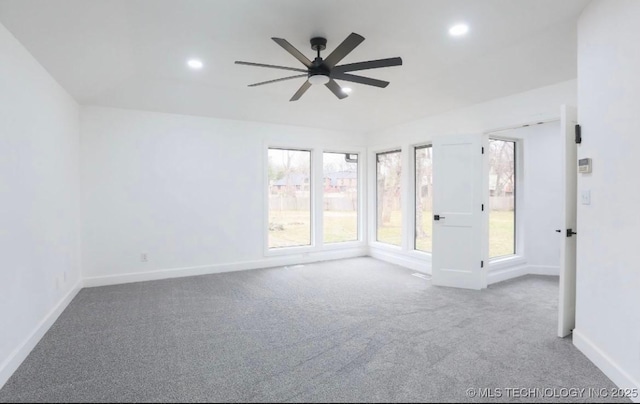 carpeted spare room featuring a ceiling fan, recessed lighting, and baseboards