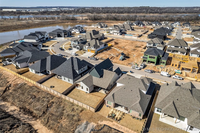 aerial view featuring a residential view and a water view