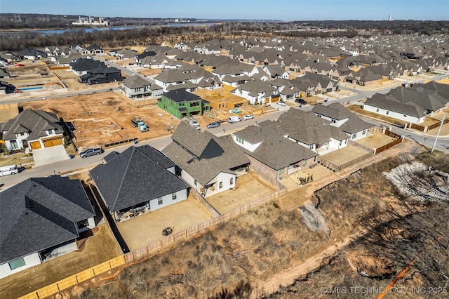 birds eye view of property with a residential view