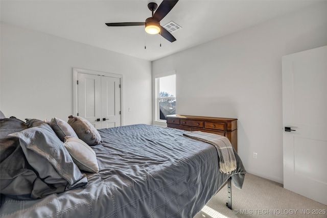 bedroom featuring a closet, visible vents, carpet floors, and ceiling fan