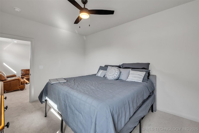 bedroom with carpet flooring, baseboards, and ceiling fan