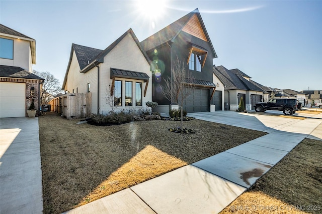 view of front of home featuring a garage, a residential view, brick siding, and driveway