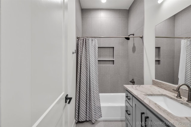 bathroom with shower / tub combo with curtain and vanity