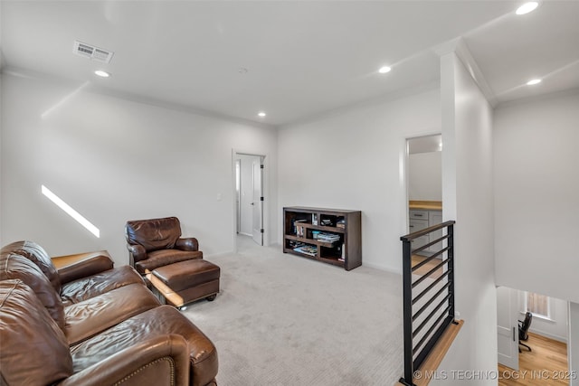 living room featuring recessed lighting, visible vents, and crown molding