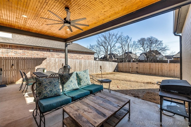 view of patio with a grill, a ceiling fan, outdoor dining area, and a fenced backyard