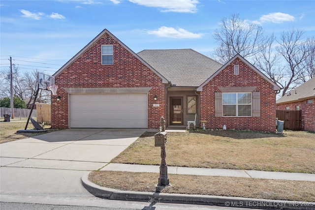 traditional-style house featuring fence, brick siding, driveway, and roof with shingles