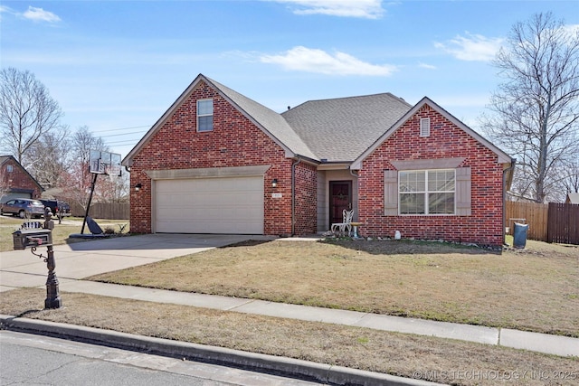 traditional-style house featuring brick siding, a front lawn, fence, concrete driveway, and an attached garage