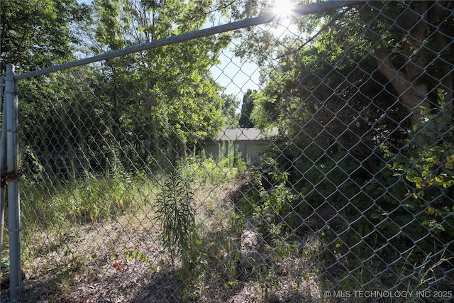 view of gate featuring fence