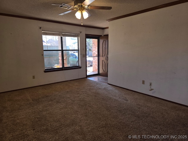 carpeted spare room with a textured ceiling, crown molding, and ceiling fan