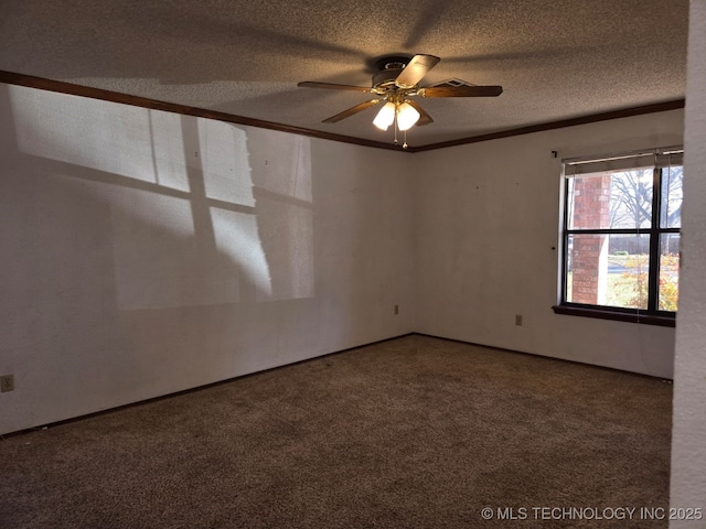 carpeted spare room with a textured ceiling, ceiling fan, and ornamental molding