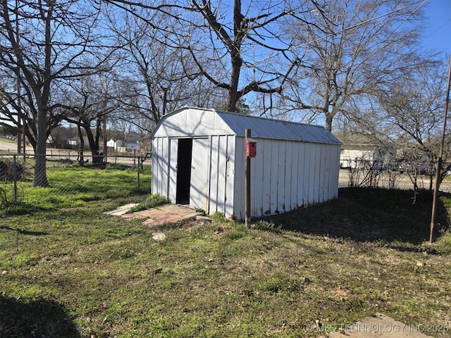 view of shed featuring a fenced backyard