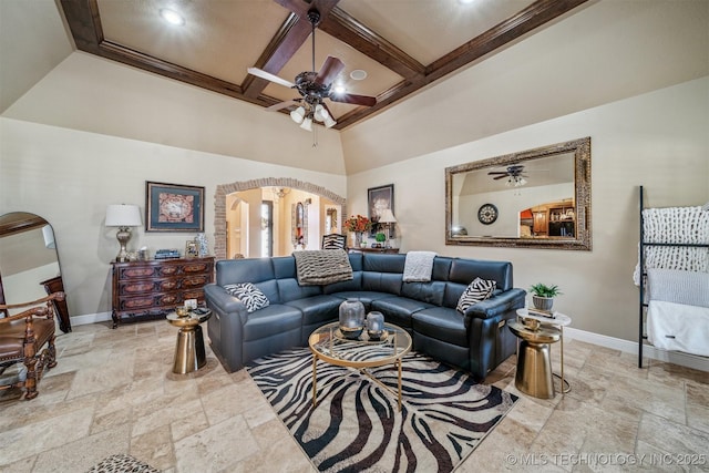 living area featuring arched walkways, coffered ceiling, baseboards, and ceiling fan