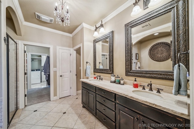 bathroom with ornamental molding, visible vents, and a sink