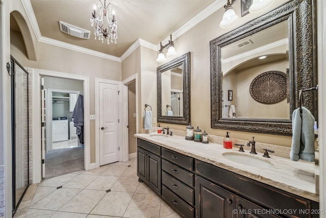 7161 Hackberry Rdg, Owasso, OK 74055 - full bath featuring crown molding, double vanity, tile patterned floors, washer / clothes dryer, and a chandelier