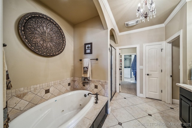 full bath with tile patterned flooring, visible vents, a jetted tub, ornamental molding, and vanity