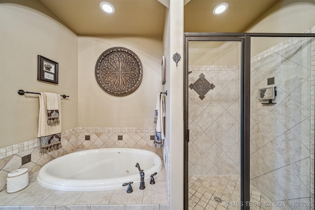 7161 Hackberry Rdg, Owasso, OK 74055 - bathroom featuring a bath, a stall shower, and recessed lighting