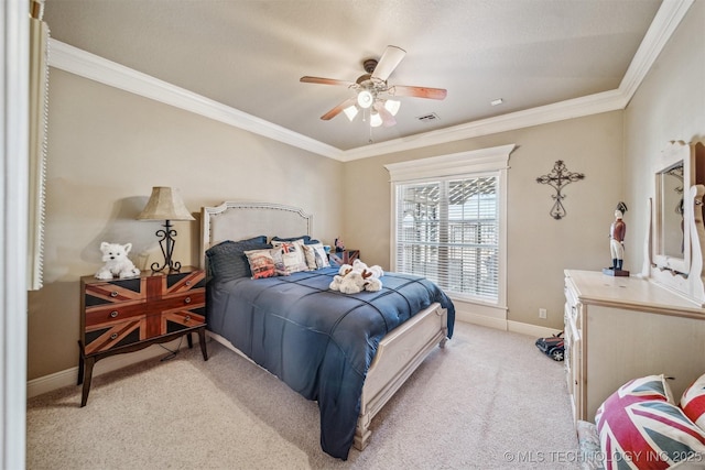 bedroom with visible vents, ceiling fan, baseboards, light colored carpet, and ornamental molding