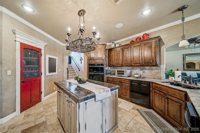 kitchen with a sink, black appliances, stone tile flooring, and ornamental molding