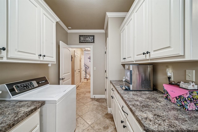 laundry area featuring washer and dryer, crown molding, cabinet space, and baseboards