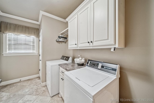 laundry room featuring crown molding, cabinet space, independent washer and dryer, and baseboards