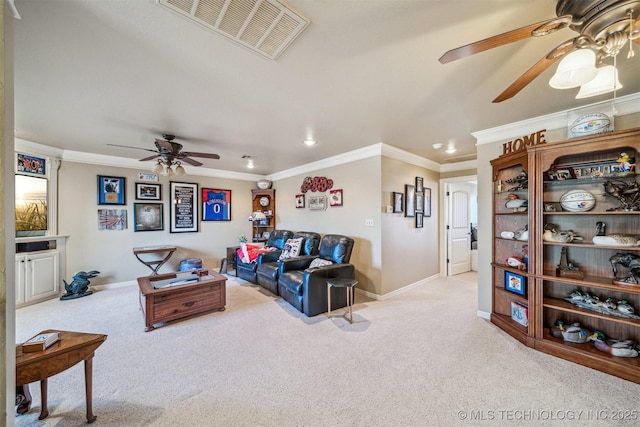 carpeted living room with visible vents, a ceiling fan, baseboards, and ornamental molding