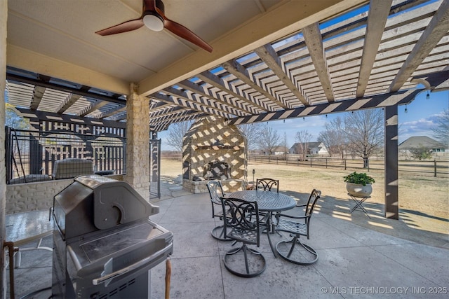 view of patio / terrace with a large fireplace, a grill, a pergola, and fence