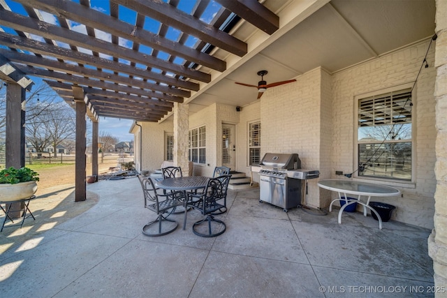 view of patio with outdoor dining area, a pergola, and a grill