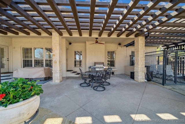 view of patio featuring outdoor dining space, a pergola, entry steps, and ceiling fan