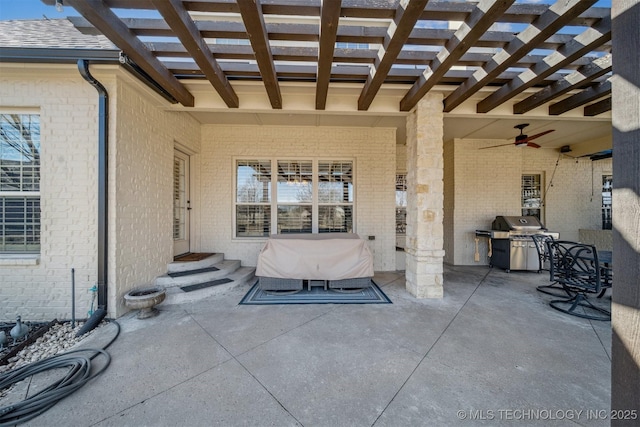 view of patio / terrace featuring area for grilling, entry steps, a pergola, and exterior kitchen