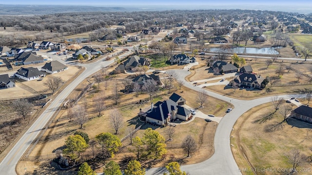 aerial view featuring a residential view and a water view