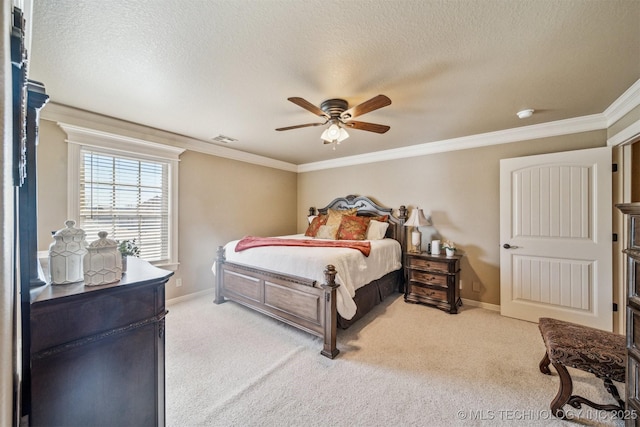 carpeted bedroom with a ceiling fan, baseboards, visible vents, ornamental molding, and a textured ceiling