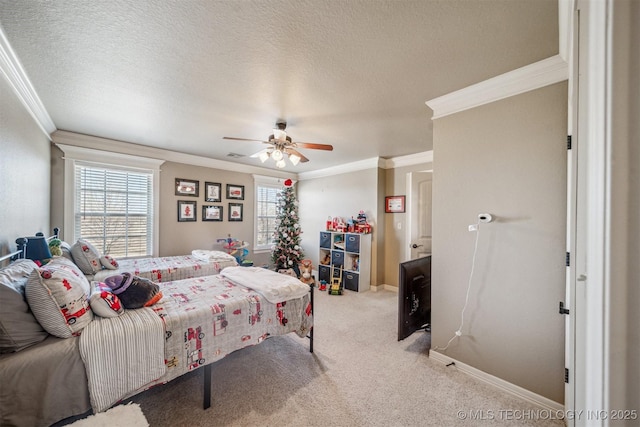 bedroom featuring crown molding, baseboards, carpet flooring, a textured ceiling, and a ceiling fan