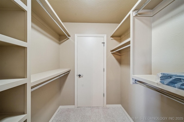 7161 Hackberry Rdg, Owasso, OK 74055 - walk in closet with carpet