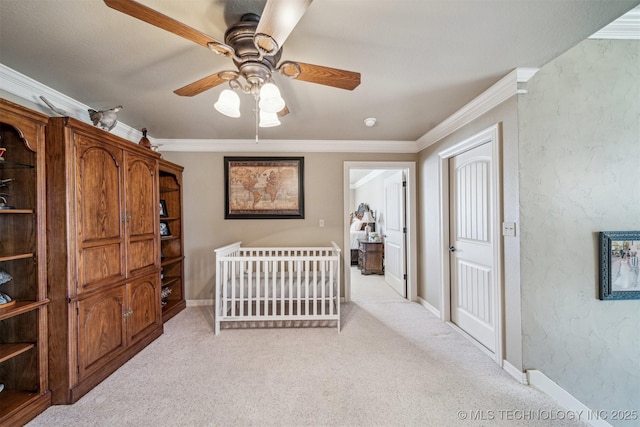 bedroom with baseboards, light carpet, ornamental molding, and a ceiling fan