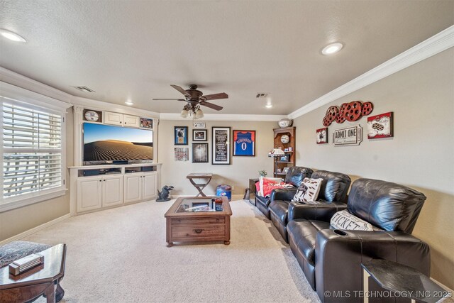 living room with crown molding, baseboards, carpet floors, recessed lighting, and a ceiling fan