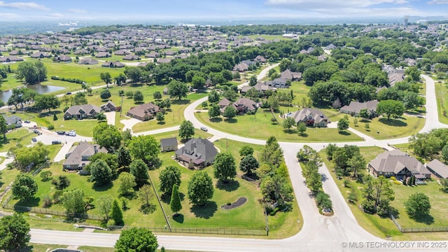 7161 Hackberry Rdg, Owasso, OK 74055 - aerial perspective of suburban area with a large body of water