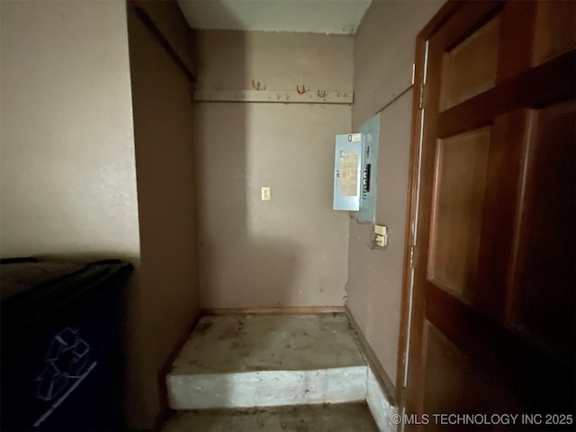 laundry area with electric panel