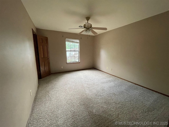 unfurnished room featuring light colored carpet, baseboards, and ceiling fan