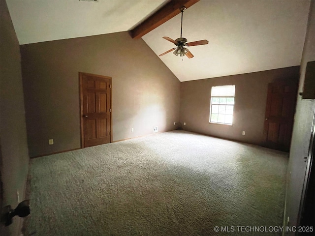 carpeted spare room with beam ceiling, a ceiling fan, and high vaulted ceiling