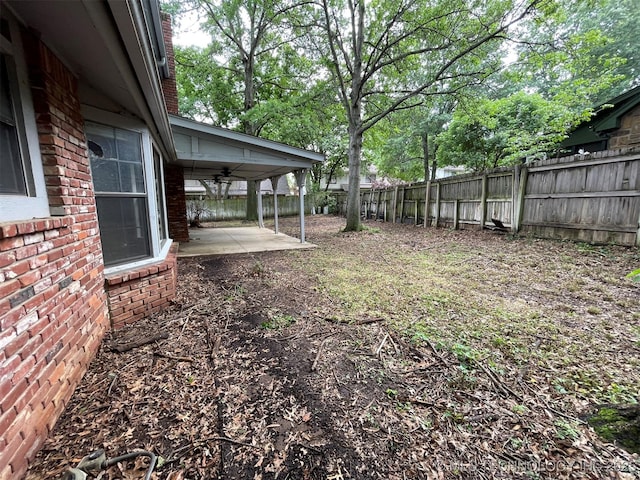 view of yard featuring a patio area and a fenced backyard