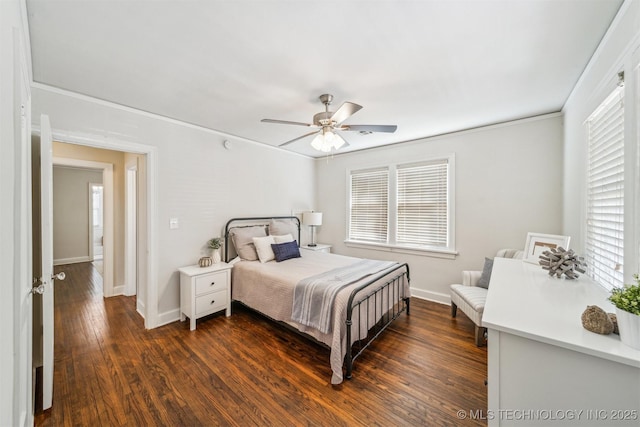 bedroom with multiple windows, baseboards, and dark wood-style flooring