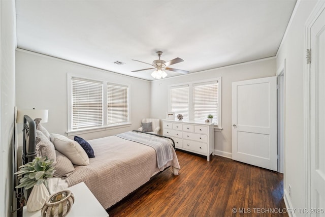 bedroom featuring visible vents, baseboards, ceiling fan, ornamental molding, and dark wood-style flooring