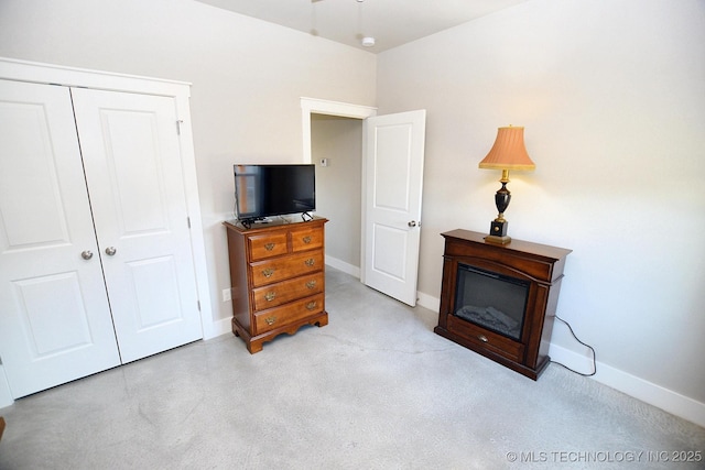 bedroom featuring a closet and baseboards